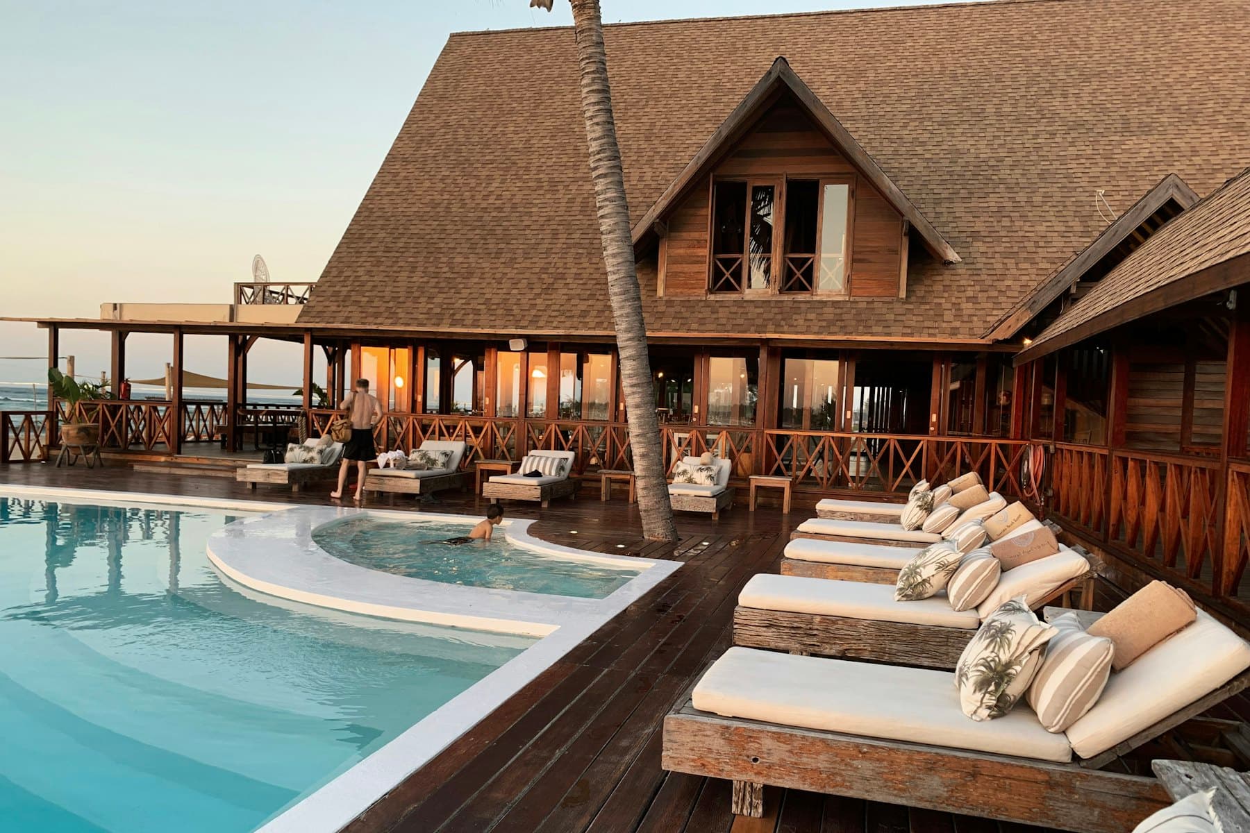 Poolside loungers at sunset